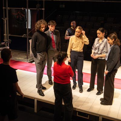 Acting and Production Arts students on stage discussing